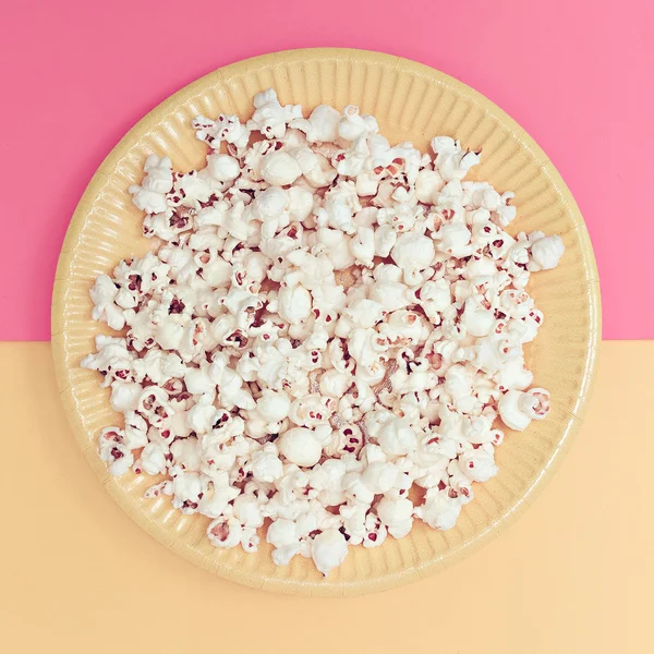 Vanilla fashion style. Popcorn in a plate. Minimalism art