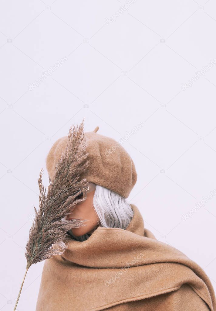 Sensual stylish Details of everyday look. Model wearing casual beige outfit. Beret, scarf. Trendy minimalistic style. Total Beige aesthetics. Fashion look book. Warm Fall Winter seasons