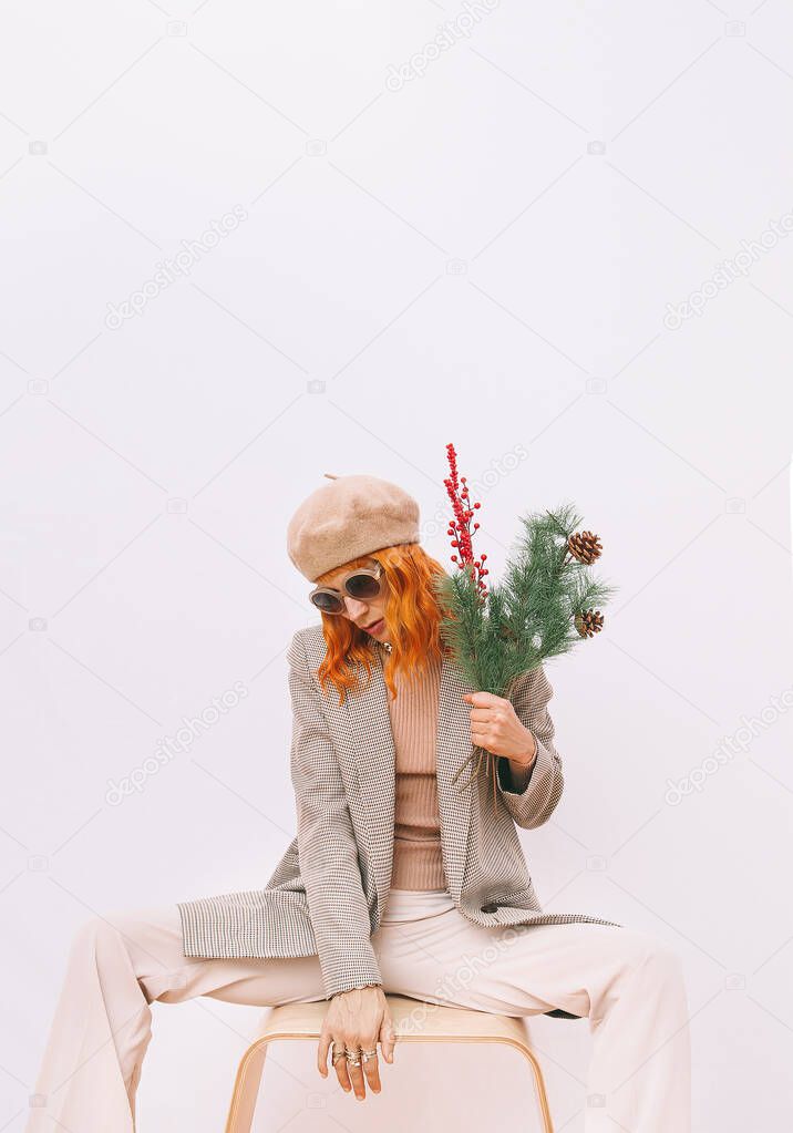 Stylish Paris Lady in fashion elegant outfit. Trendy beige beret, sunglasses and stylish plaid blazer. Beige total. Style in details. Fall winter season