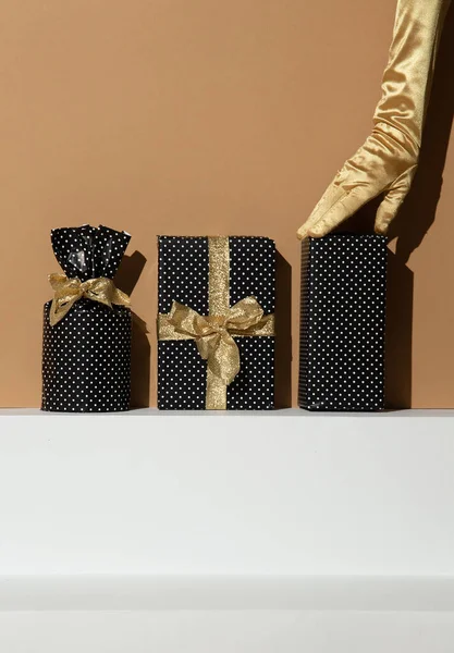 Hand Golden Gloves Holding Gift Box Minimal Still Life Design — Stock Photo, Image