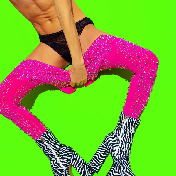 Fashion sexy girl in heel party zebra boots and pink leggins down on green minimal background. Stylish clubbing mood.  Go-go Girls. Cabaret. After party adult concept