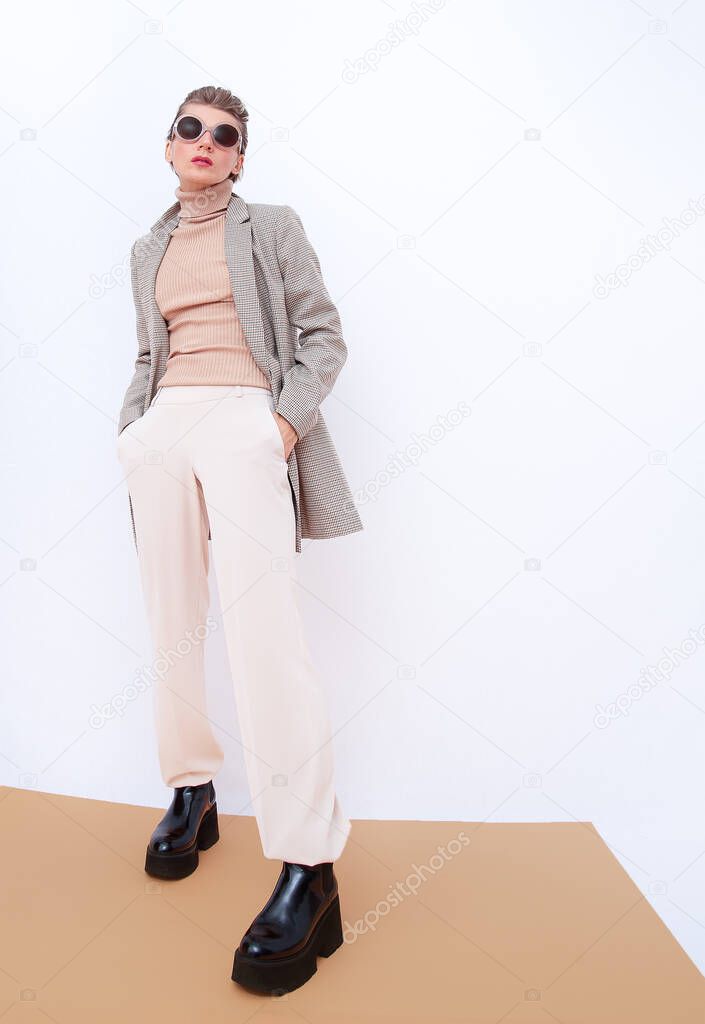 Stylish Paris Model. Details of everyday look. Casual beige outfit. Trendy Minimalistic style. Total Beige aesthetics. Fashion fall winter spring look book.