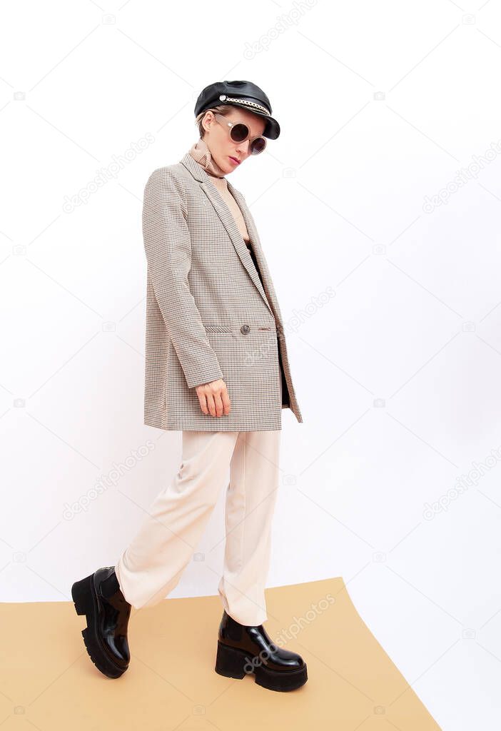Stylish vintage Model. Details of everyday look. Casual beige outfit. Trendy Minimalistic style. Total Beige retro aesthetics. Fashion fall winter spring look book.