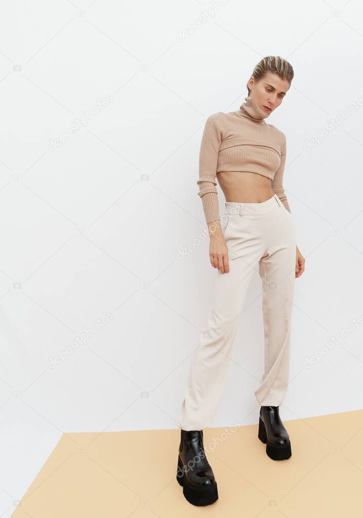 Stylish Girl.  Details of everyday look. Casual beige outfit. Trendy Minimalistic style. Total Beige aesthetics. Fashion fall winter spring look book.