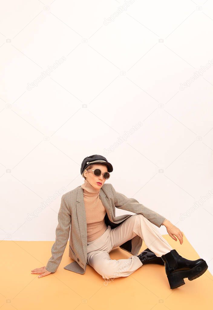 Stylish vintage Model. Details of everyday look. Casual beige outfit. Trendy Minimalistic style. Total Beige aesthetics. Fashion fall winter spring look book.
