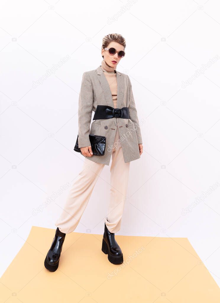 Paris Model. Details of everyday look. Casual beige outfit. Trendy Minimalistic style. Total Beige retro aesthetics. Fashion fall winter spring look book.