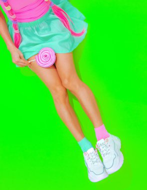 Summer sweet unrecognizable girl Fashion minimal style. Kawaii party mood.  lolli pop lover. Candy shop concept