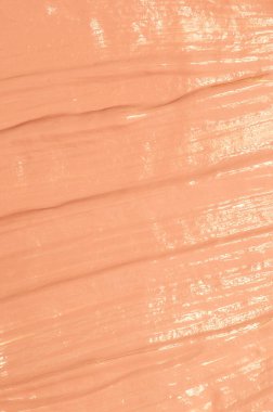 Bej rengi tonal temel doku duvar kağıdı lekesi. Makyaj ve cilt bakımı için kozmetik ürünleri