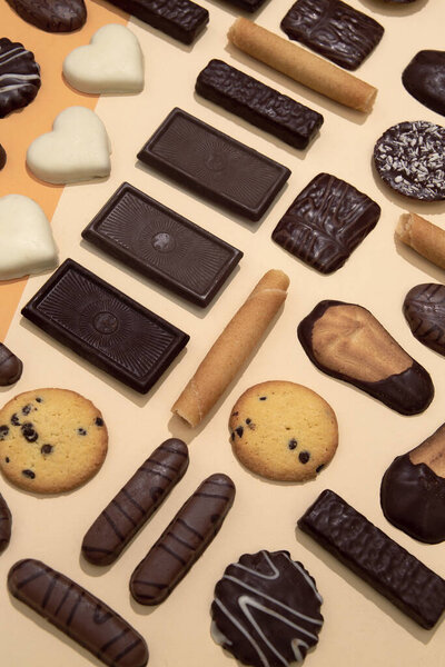 Chocolate cookies mix background. Sweets choco lover design. Minimal art. Holidays  time, winter christmas celebration vertical wallpaper