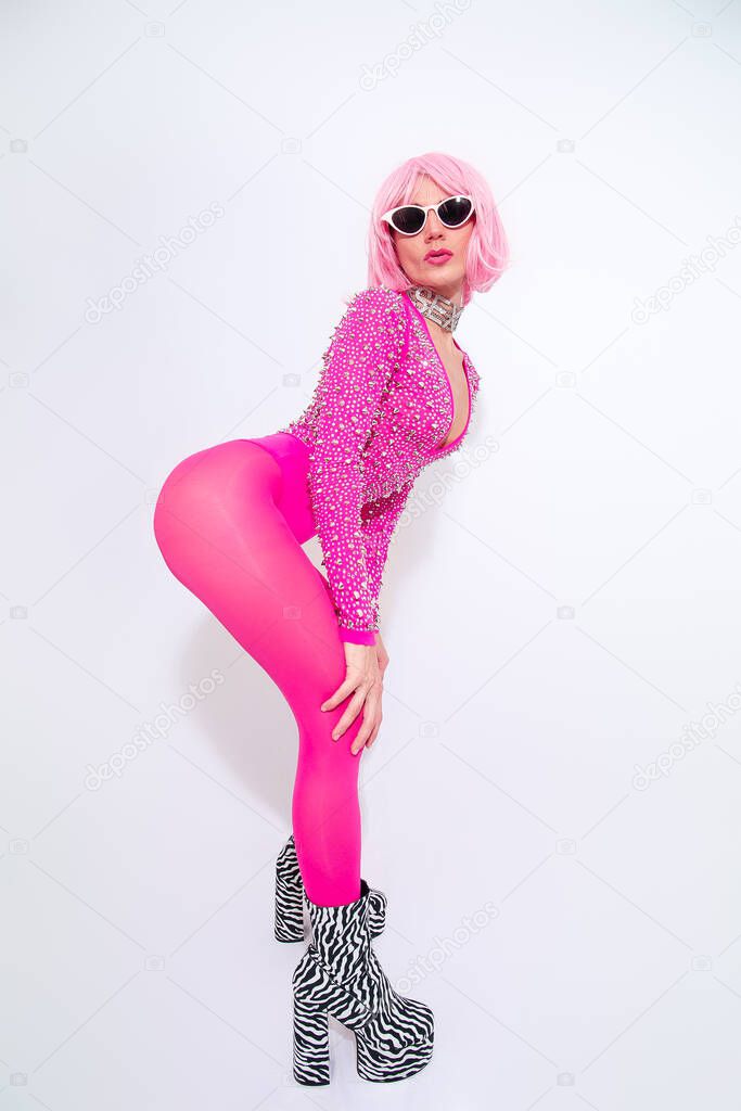 Disco Lady posing in white studio. Pink vibes. Back in 80s  retro look. Clubbing glamour style