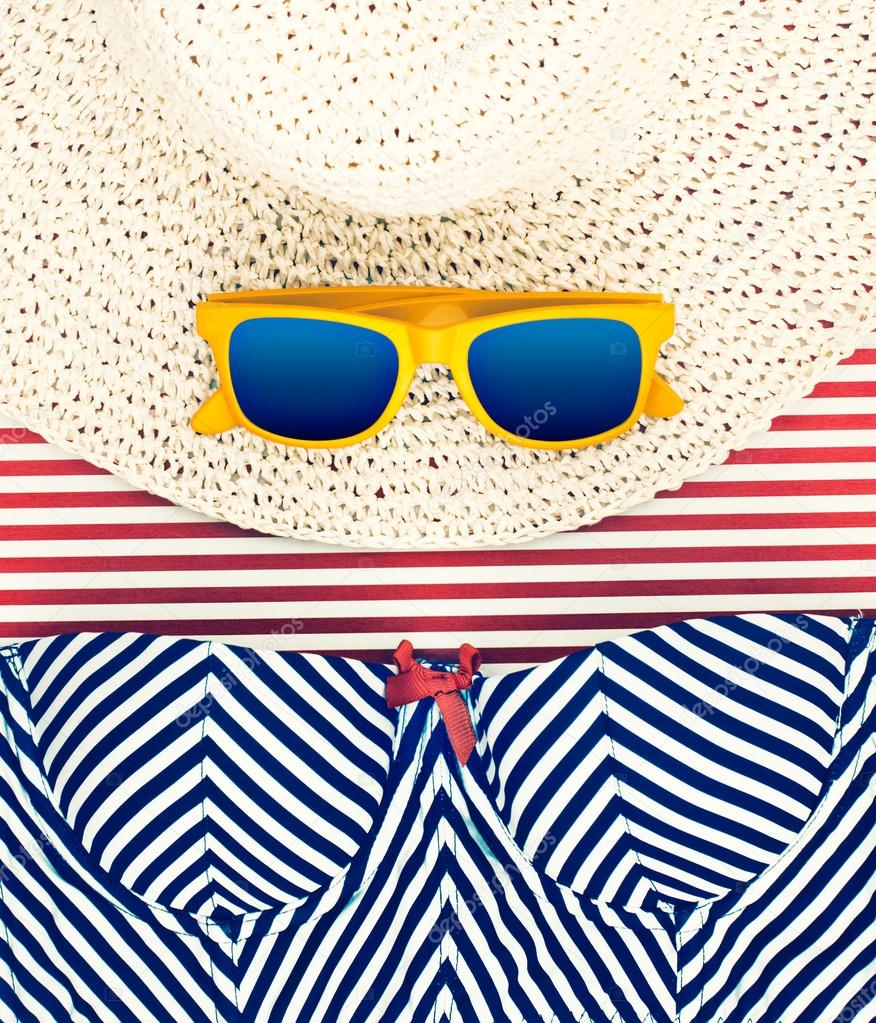 Sunglasses on Hat with Striped Shorts Still Life