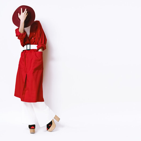 Beautiful vintage lady fashionable style in a red cloak and hat