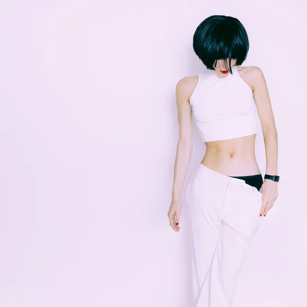 Sensual brunette model on white background in white clothing — Stock Photo, Image