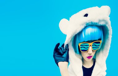 Crazy party girl in hoodie bear on a blue background. positives clipart