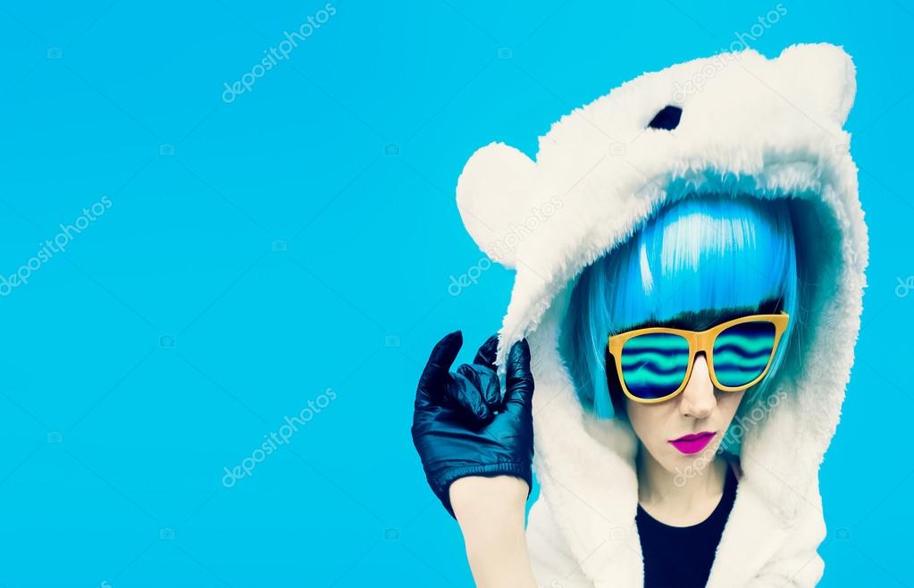 Crazy party girl in hoodie bear on a blue background. positives