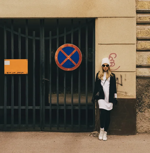 blonde on city street. Trendy urban Loock. Black and white fashi