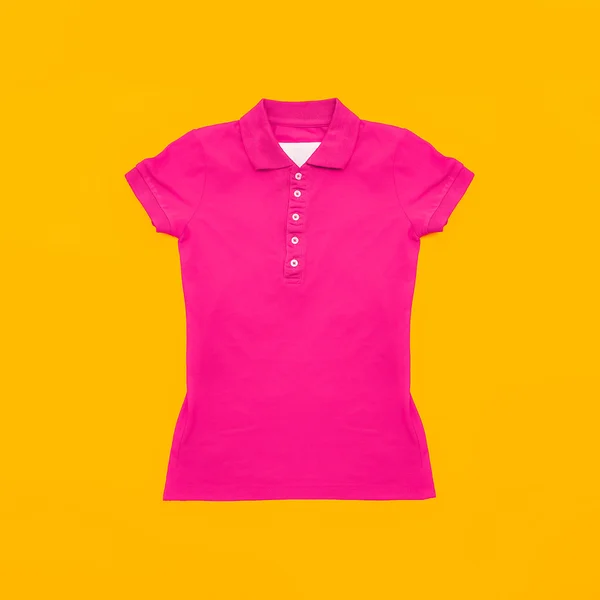 Bright crimson polo shirt on yellow background. Fashion bright s — Stock Photo, Image