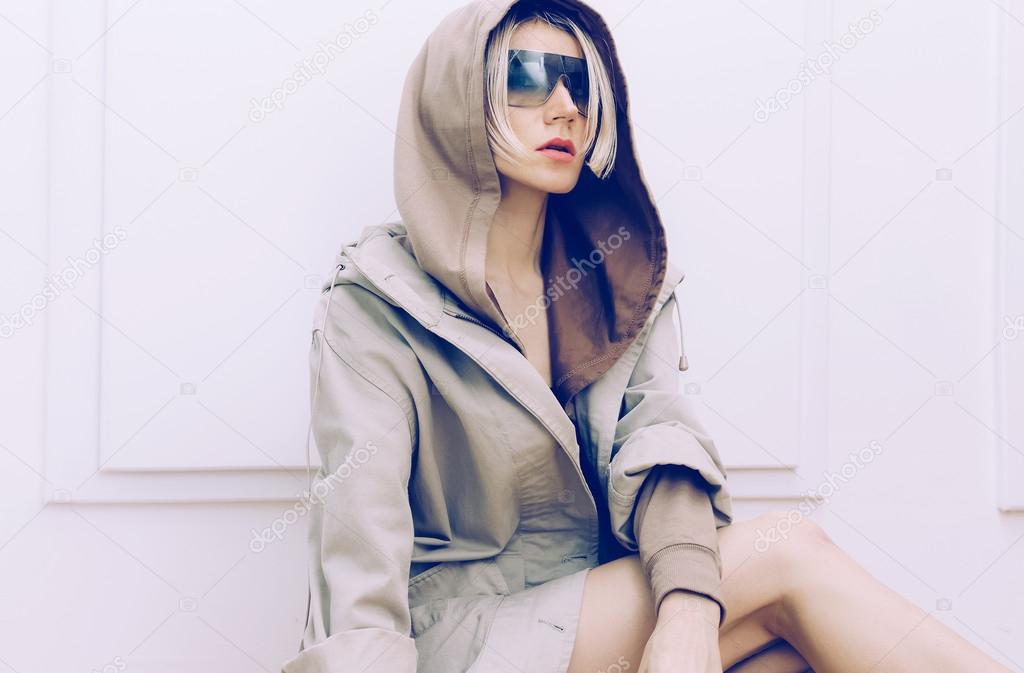 Sensual model in trendy denim coat. Spring fashion accessories. 