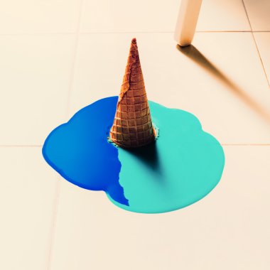 Fake ice cream flows down on the floor. fashion background