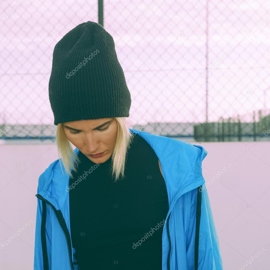 Stylish girl in bright blue coat and hat. City Style. Autumn in 