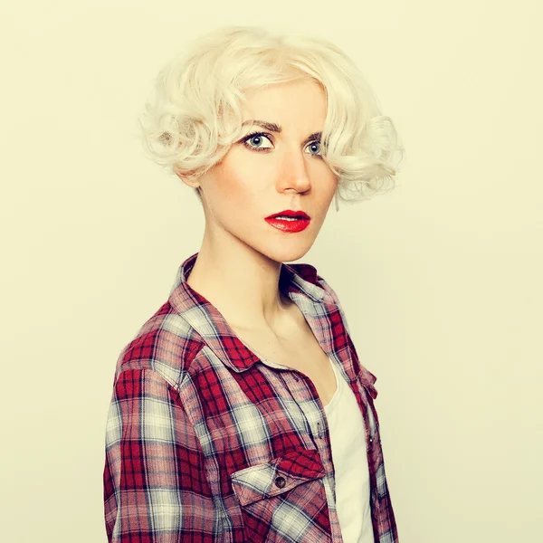 Glamorous sensual blonde in checkered shirt. — Stock Photo, Image