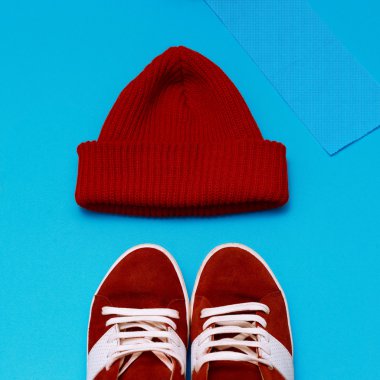 Stylish urban hipster set. Red sneakers and hat clipart