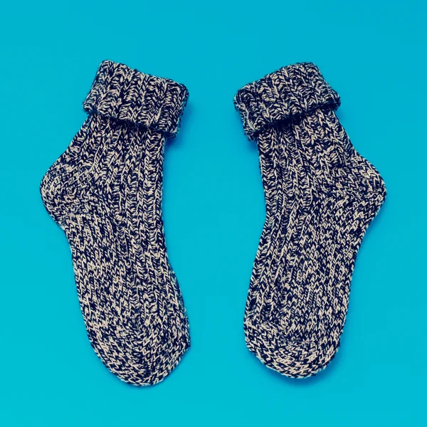 Warm woolen Socks on blue background — Stock Photo, Image