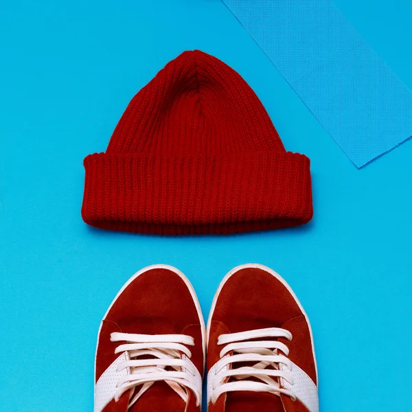 Stylish urban hipster set. Red sneakers and hat — Stock Image Stylish urban hipster set. Red sneakers and hat Stock Photo