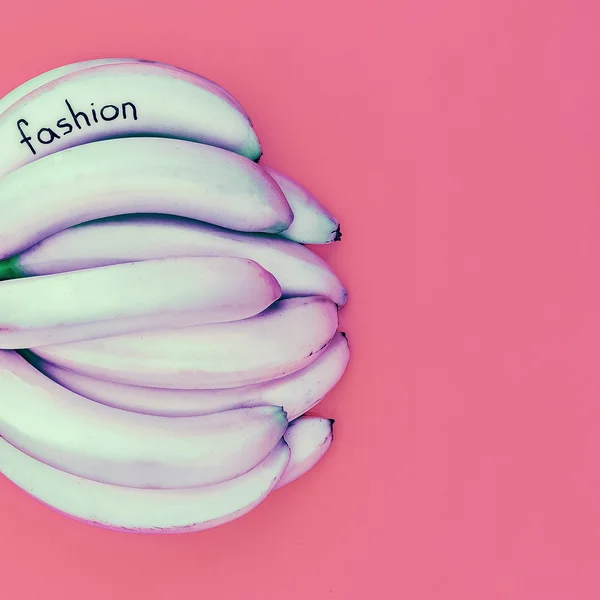 Pastel colors. Minimal fashion. Bunch bananas — Stock Photo, Image