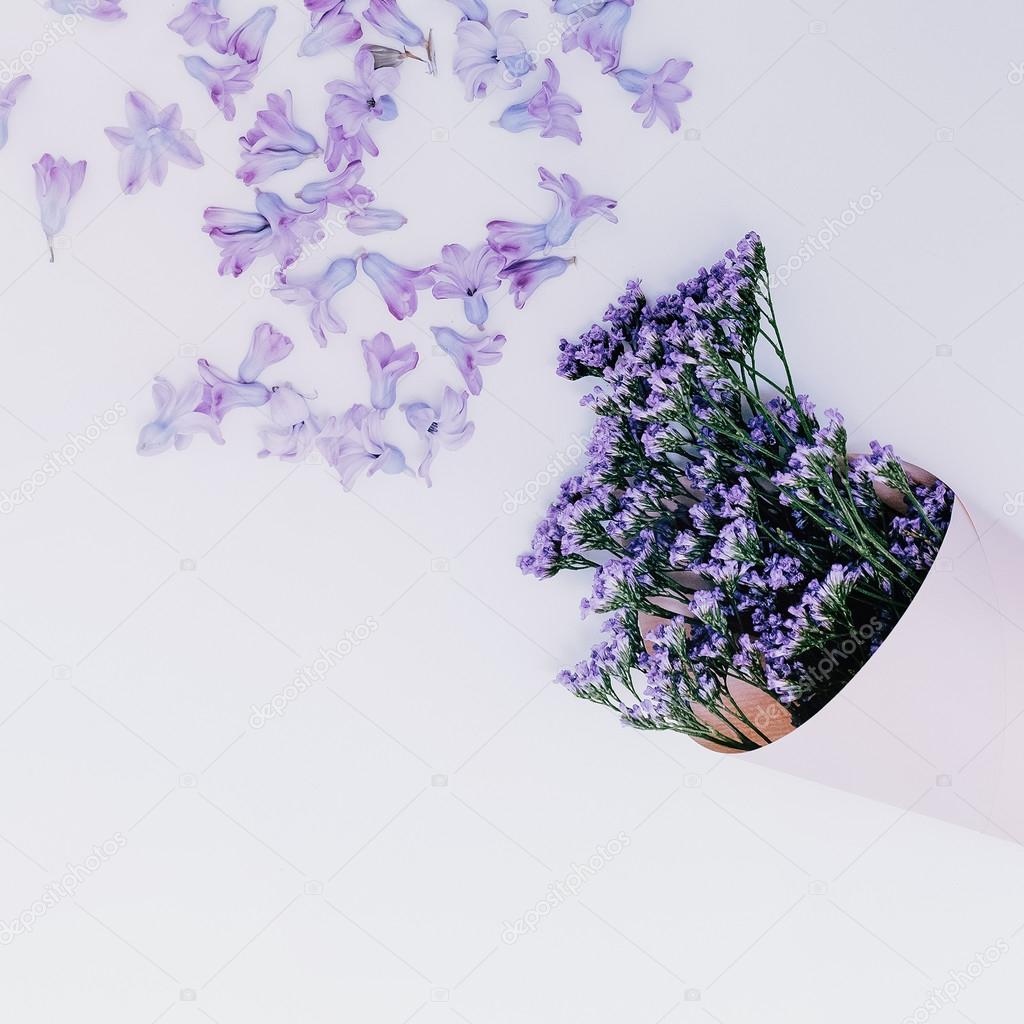 Purple flowers on white background. Aroma of Spring. Minimalism 