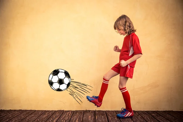 Child is pretending to be a soccer player