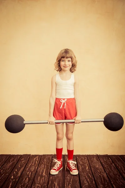 Strong child with barbell. — Stock Photo, Image