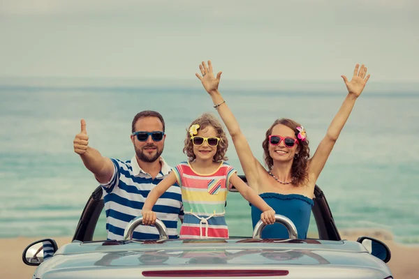 Happy family in car