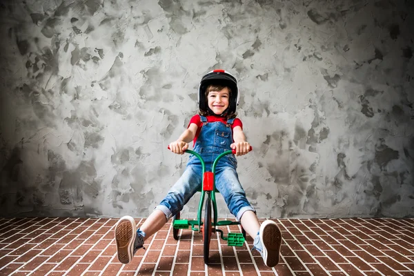 Child riding on retro bicycle — Stock Photo, Image