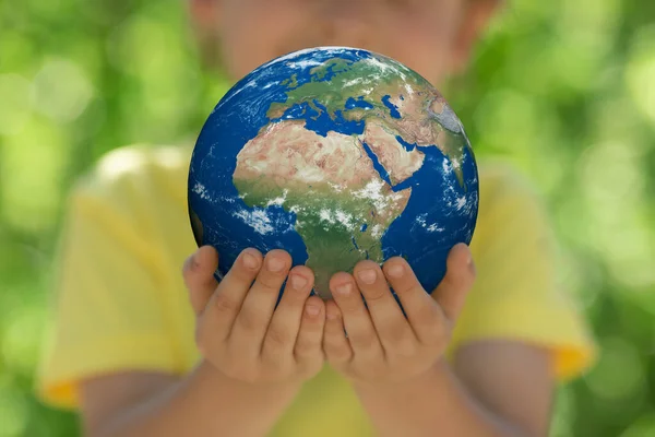 Child Holding Planet Hands Green Blurred Background Earth Day Spring — Stock Photo, Image