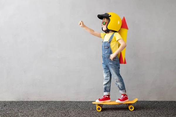 Happy Child Playing Toy Paper Rocket Grey Concrete Wall Background — Stock Photo, Image