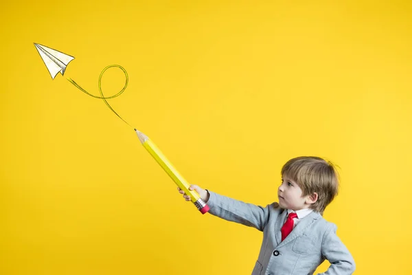 Niño Feliz Sosteniendo Lápiz Sobre Fondo Amarillo Creación Empresas Concepto — Foto de Stock