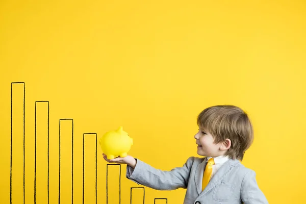 Happy Child Holding Piggybank Yellow Background Business Start Education Concept — Stock Photo, Image