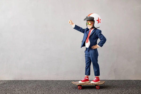 Happy Child Wearing Suit Riding Skateboard Grey Concrete Wall Background — Stock Photo, Image