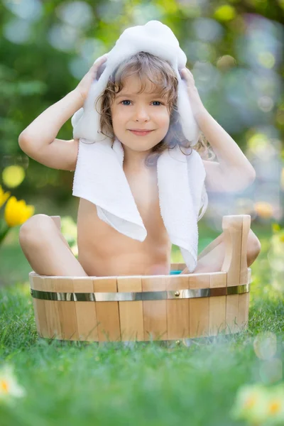 Child bathing outdoors in spring — Stock Photo, Image