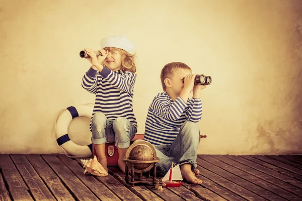 Children playing with vintage nautical things — Stock Photo, Image