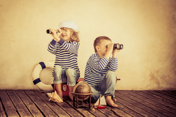 Children playing with vintage nautical things