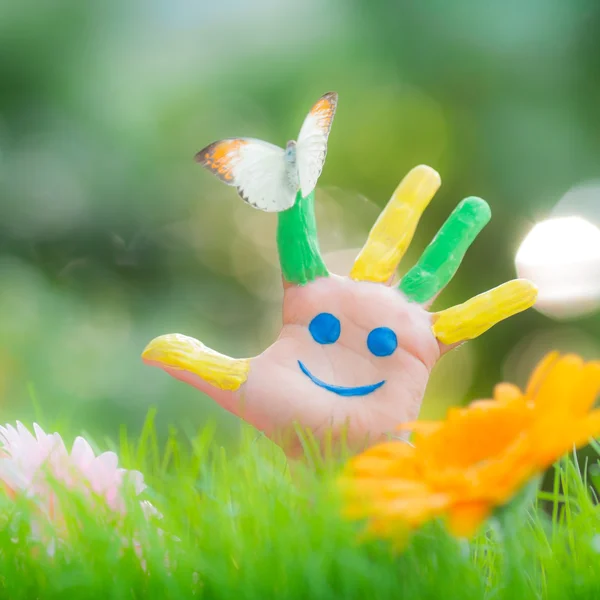 Butterfly on hands  on spring — Stock Photo, Image