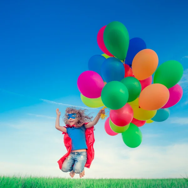 Superbohater z zabawkami balony — Zdjęcie stockowe