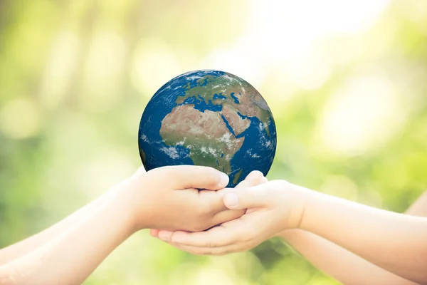 Child holding Earth planet — Stock Photo, Image