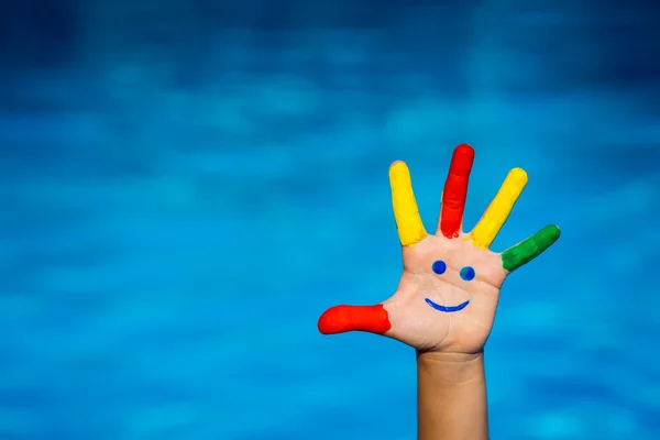 Smiley on kid hand — Stock Photo, Image