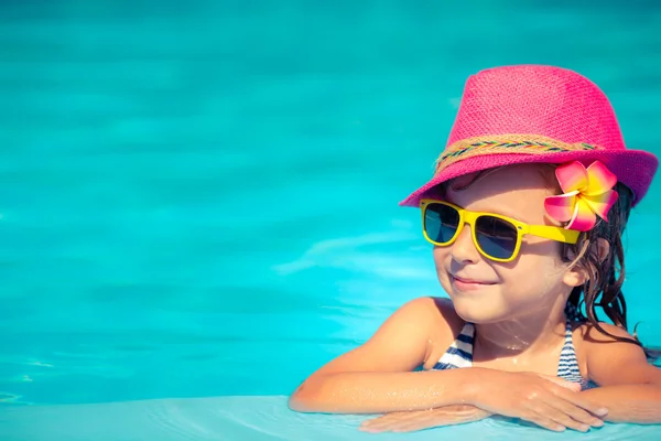 Child playing in swimming pool Stock Picture