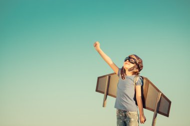 Happy child playing outdoors clipart