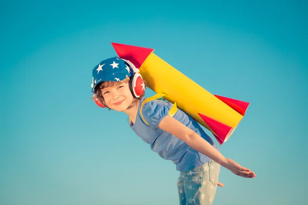 Happy child playing outdoors — Stock Photo, Image