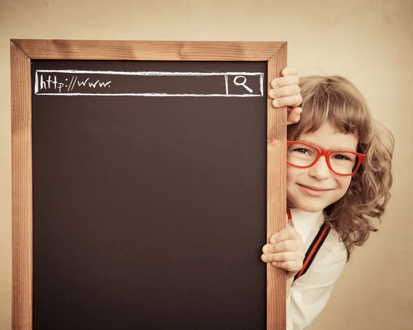 Child holding blackboard blank — Stock Photo, Image